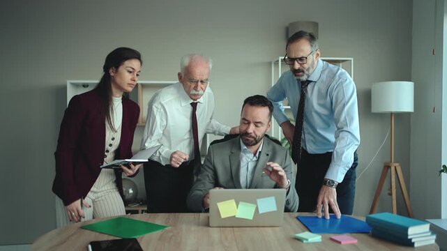 Multi-Generational Business Team Concerned in Modern Office &ndash; Business Problem Concept