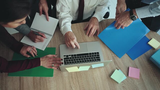 Close-Up of Multi-Generational Business Team Hands Working in Modern Office