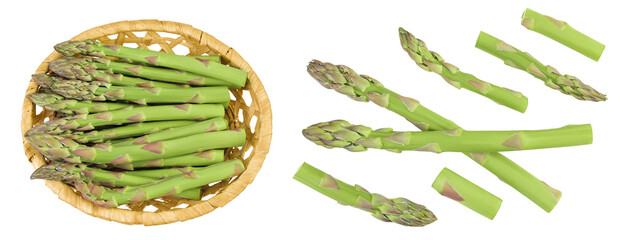 fresh asparagus in in a wicker basket isolated on white background. Top view. Flat lay.