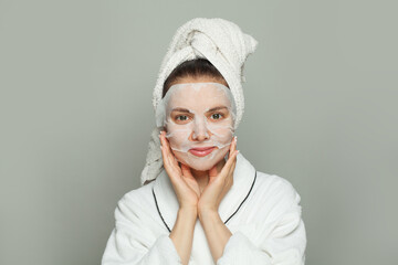Indoor portrait of young woman with moisturizing
