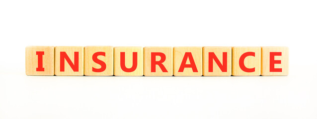 Obraz premium Insurance symbol. Concept words Insurance on beautiful wooden blocks. Beautiful white background. Business support medical insurance concept. Copy space.