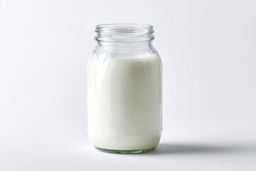 Clear glass milk jar on a pristine white background with soft studio lighting