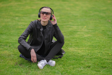 Woman enjoying a sunny spring day in the park. Happy woman outdoors. Fresh start, springtime joy