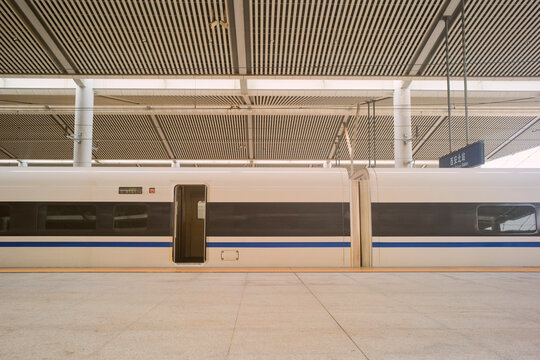 High-speed train at a modern, empty station with open doors and smooth platform. Chengdu, Sichuan, China