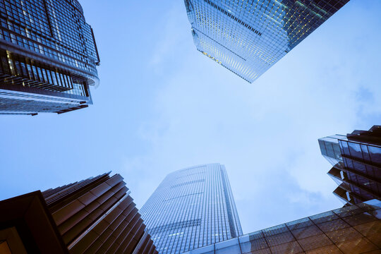 Urban skyscrapers converge towards a clear blue sky, showcasing modern architecture. Guangzhou, Guangdong, China