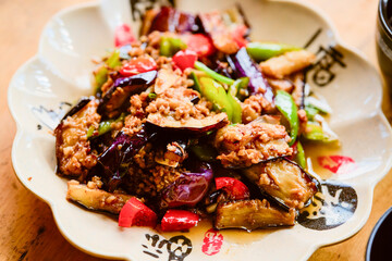 Delicious stir-fried eggplant dish with minced meat, bell peppers, and green onions. Longji (Longsheng) Rice Terraces, Longsheng, China