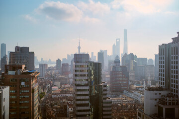 Panoramic cityscape of Shanghai with towering skyscrapers and a hazy sky Shanghai, China