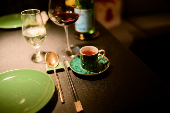 Elegant dining table with wine, coffee, and place settings. Shanghai, China