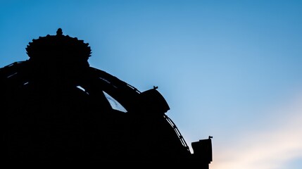 dome. Silhouetted architectural dome against a dawn sky, showcasing abstract monument shapes with gradient sunrise colors. real-estate listings.