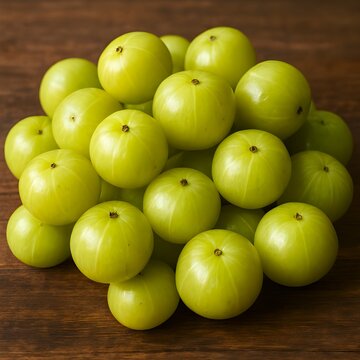 Lots of fresh amla emblica Indian gooseberry fruits on a green vegetable background, amla, emblica generated by AI