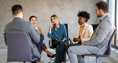 Business team having a meeting in office and solving problem. Teamwork, people and crisis concept.
