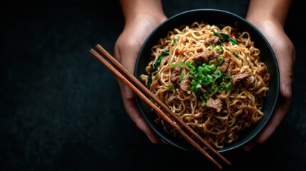 A close-up of a bowl filled with savory noodles garnished with green onions and meat, showcasing the vibrant colors and textures of this mouth-watering dish.