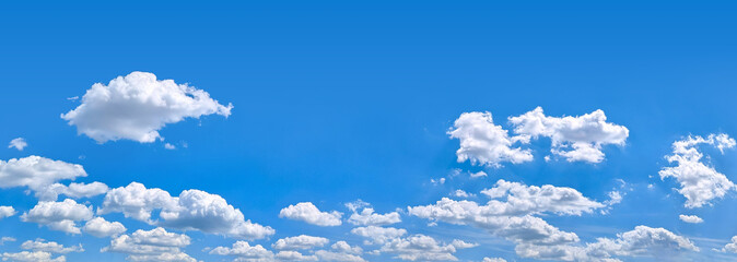 Beautiful clouds on deep blue sky background. Elegant white clouds in daylight after rain. Panorama...