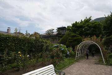 White Garden Arch and Strolling Visitors in Scenic Hakodate
