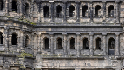 a stone building with large arched windows that burned down in a fire