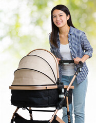 Asian woman with baby stroller in the park, shallow depth of field