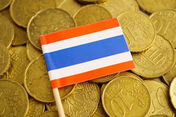 Thailand flag on coin and banknote money, finance trading investment business currency concept.