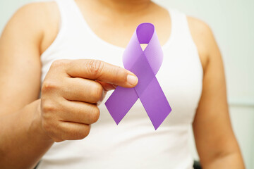 Asian woman with purple ribbon for September World pancreatic cancer day or world Alzheimer day.