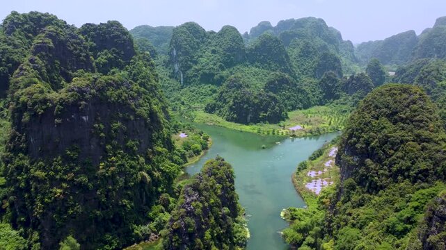 Aerial view of Trang An karst mountains and winding river, Ninh Binh, Vietnam