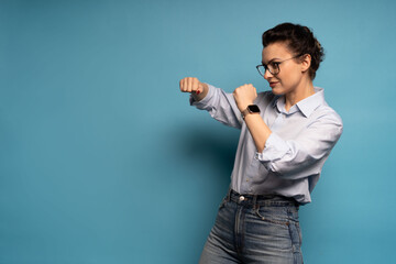 Brunette woman giving a punch