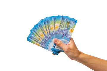 Man hand holding a fan of Indonesian Rupiah banknotes isolated on white background. Close up of person holding many fifty thousand IDR bills.