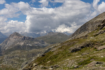 Fototapeta premium Panoramic mountain view of the Mont-Cenis Massif ,Savoie, French Alps, featuring rugged peaks, alpine meadows, and natural high-altitude scenery.
