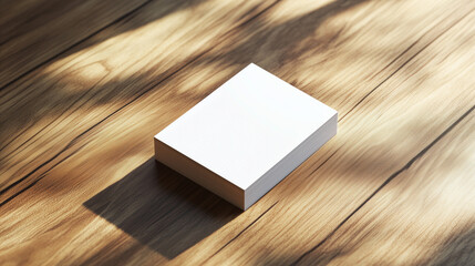 Blank business cards stack on a wooden surface with natural light and copy space
