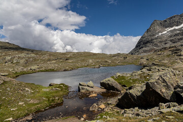 Lac Giaset in the Mont-Cenis Massif, Savoie, French Alps, high-altitude alpine lake surrounded by rugged mountains and pristine nature.