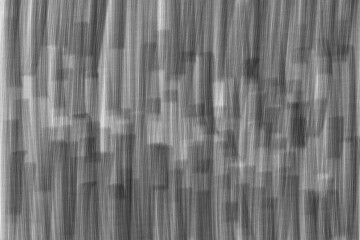 Abstract Architecture in Grayscale: An artistic depiction of a blurred cityscape in a grayscale palette, evoking a sense of urban energy and modern architecture.