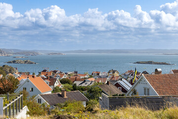 Charming coastal houses on the island of Stora Dyron at the coast of Tjorn in Sweden, a sunny seaside village