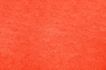 Texture of grained pink decorative plaster stucco or concrete wall fence interior exterior background. Abstract modern new backdrop for design.