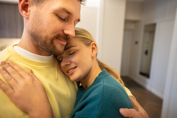 Fototapeta premium True love and care in modern relationships, man and woman couple hugging each other with happy smiles and tenderness, demonstrating trust and protection, safe place for emotions feelings and bonding.