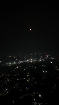 Aerial Night Timelapse of Busy Indian City Street with Flyover and Urban Traffic Flow.