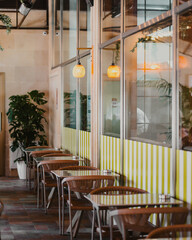 Modern restaurant interior with warm lighting and minimalist tables