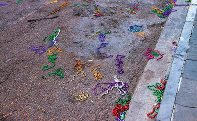 Colorful beads scattered on New Orleans streets after Mardi Gras celebration