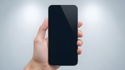 A hand holding a smartphone with a blank screen in vertical 9:16 composition, designed for mobile advertising, social media content, and app promotion.