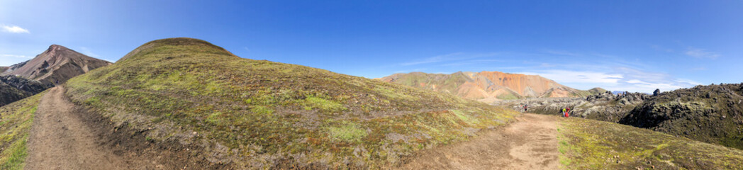 Fototapeta premium Sunny day in Landmannalaugar Iceland showcasing vibrant landscape, mountains, and wilderness