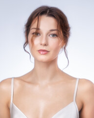 Serene Portrait of a Beautiful Young Woman with Natural Makeup and Healthy Skin