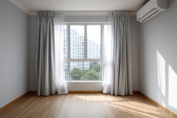 Obraz premium Interior room features a large window with drawn curtains overlooking urban buildings and greenery