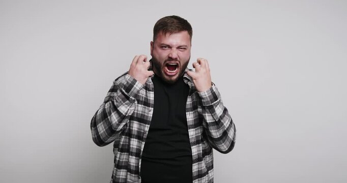 Man practices self-reflection and mindfulness in simple indoor setting during calm moment