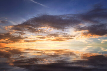 Cumulus sunset clouds with sun setting down,Clouds reflextion on during sunset