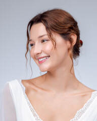Smiling Woman in White Dress With Natural Beauty and Soft Expression