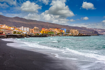 Obraz premium Black sand beach in Candelaria. Candelaria is city in the eastern part of island of Tenerife in the Province of Santa Cruz de Tenerife, in the Canary Islands, Spain.