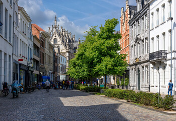 Cozy old street with tables of cafe in Mechelen, Belgium. Mechelen is a city and municipality in...