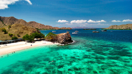 Fototapeta premium Aerial view of the famous Pink Beach in Komodo National Park with vibrant coral-colored sand