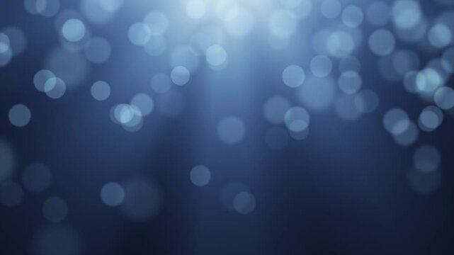 Soft Blue Defocused Bokeh Lights with Light Rays.Abstract soft blue bokeh circles floating with volumetric light rays, Dreamy background loop.Video effect