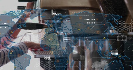 Operating barista wearing striped shirt inserting portafilter at counter, with espresso machine HUD