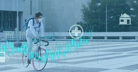 Riding Asian man wearing striped shirt, mask, blue backpack crossing plaza on bike, digital charts