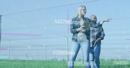 Pointing manager in flannel with tablet, guiding farmer in plaid in netted rows with overlays