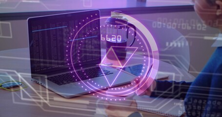 Displaying laptop showing code on desk with purple HUD phone notebook woman writing in blue sweater